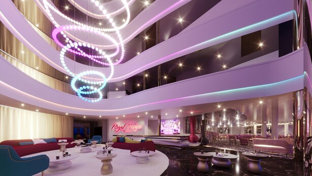 A modern hotel lobby with a central seating area, a neon sign reading "Royal Palace," and a large, circular light installation. - Royal Palace Hotel & Spa (Kirrwiller-Bosselhausen)