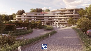 A multi-story hotel with a modern design, featuring a central courtyard with a fountain, surrounded by lush greenery and a paved walkway. - Royal Palace Hotel & Spa (Kirrwiller-Bosselhausen)