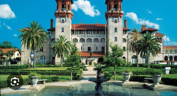 A historic building with two towers, a central entrance, and a fountain in the foreground. - Escape with Private Beach Access & Coastal Charm (St. Augustine)