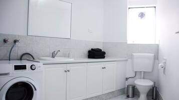 Shower, hair dryer, towels, soap