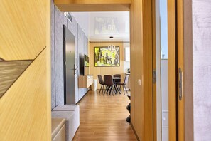 Deluxe Apartment, Balcony, Partial Sea View | Living area | 110-cm flat-screen TV with cable channels