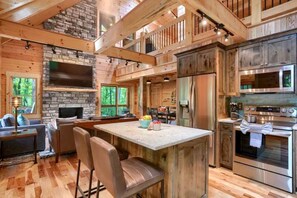 Coffee/tea maker, fridge, microwave, oven - Glamping Escapes in Logan in this Luxury Log Cabin Rental with Fire-Pit and Hot-Tub (Logan)
