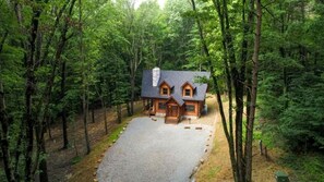Exterior - Glamping Escapes in Logan in this Luxury Log Cabin Rental with Fire-Pit and Hot-Tub (Logan)