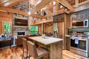 Fridge, microwave, oven, stovetop - Glamping Escapes in Logan in this Luxury Log Cabin Rental with Fire-Pit and Hot-Tub (Logan)