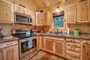 Fridge, microwave, stovetop, coffee/tea maker