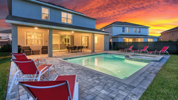 A modern house with a swimming pool, outdoor seating, and a covered patio area. - 25% Off Encore Resort Arcade Home (Kissimmee)