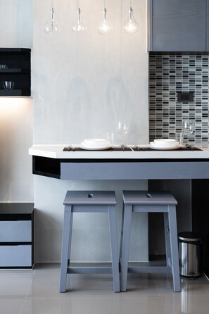 Fridge, microwave, toaster, dining tables