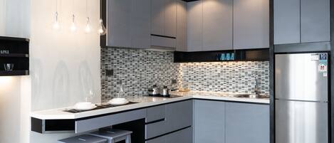 Fridge, microwave, toaster, dining tables