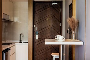 Fridge, microwave, stovetop, dining tables