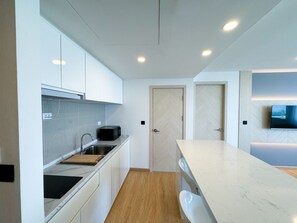 Fridge, microwave, stovetop, dining tables