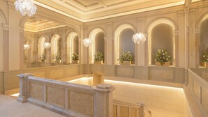 A grand lobby with arched ceilings, marble columns, and a central staircase. - EST Hotel Palais Chotek NEW OPENING (Vienna)