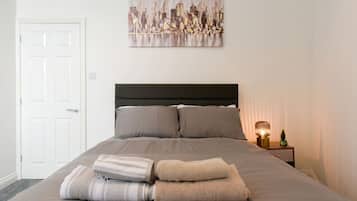 1 bedroom, desk, iron/ironing board, travel crib