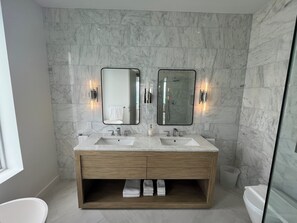 Shower, hair dryer, towels, soap