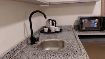Habitació individual Deluxe, vistes a la ciutat | Cuina privada