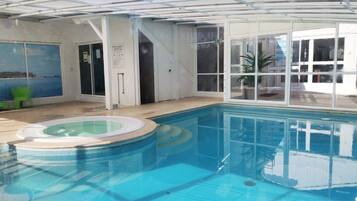 Indoor pool, outdoor pool, open 11:00 AM to 7:00 PM, pool umbrellas