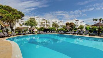 Indoor pool, outdoor pool, open 11:00 AM to 7:00 PM, pool umbrellas