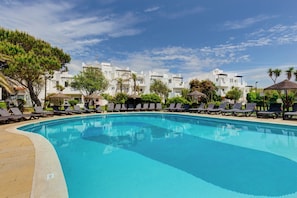 Indoor pool, outdoor pool, open 11:00 AM to 7:00 PM, pool umbrellas