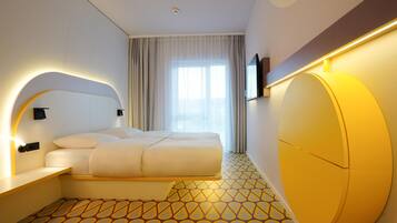 Hypo-allergenic bedding, desk, laptop workspace, blackout curtains