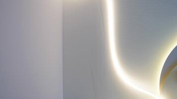 Hypo-allergenic bedding, desk, laptop workspace, blackout curtains