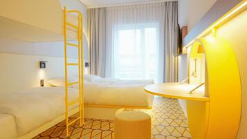 Hypo-allergenic bedding, desk, laptop workspace, blackout curtains