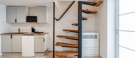 Fridge, microwave, stovetop, coffee/tea maker