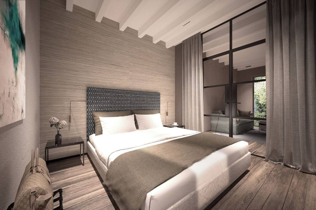 Exclusive Suite, Partial Lake View | In-room safe, desk, laptop workspace, blackout drapes