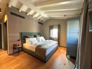 Luxury Room, Partial Lake View | Minibar, in-room safe, desk, laptop workspace