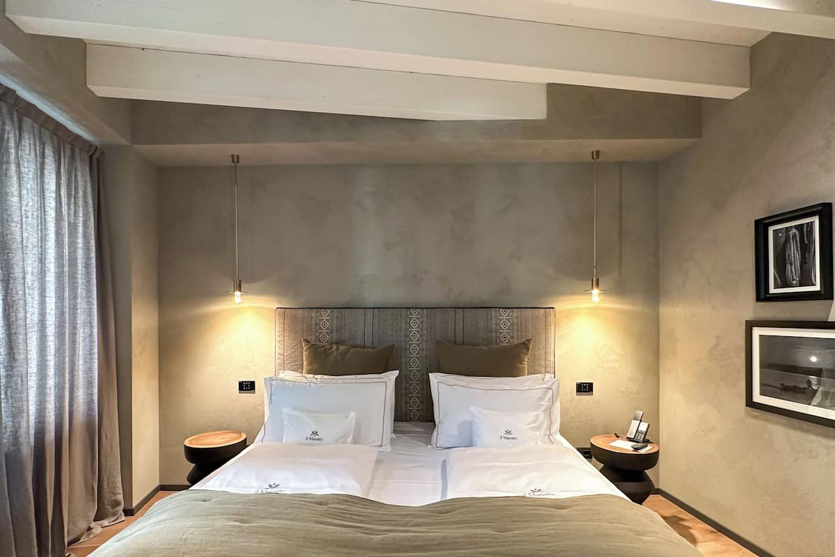 Exclusive Suite, Partial Lake View | Minibar, in-room safe, desk, laptop workspace