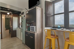 Fridge, microwave, stovetop, coffee/tea maker