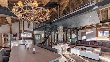 Luxury Chalet, 4 Bedrooms, Balcony, Mountain View | Living area | 64-inch flat-screen TV with satellite channels, fireplace