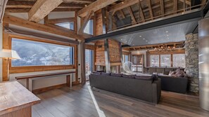 64-inch flat-screen TV with satellite channels, fireplace