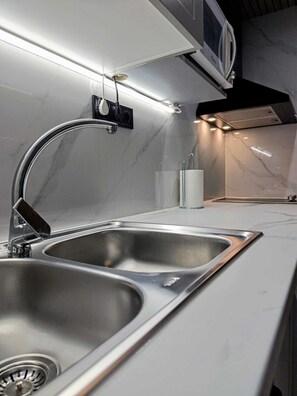 Fridge, microwave, stovetop, coffee/tea maker