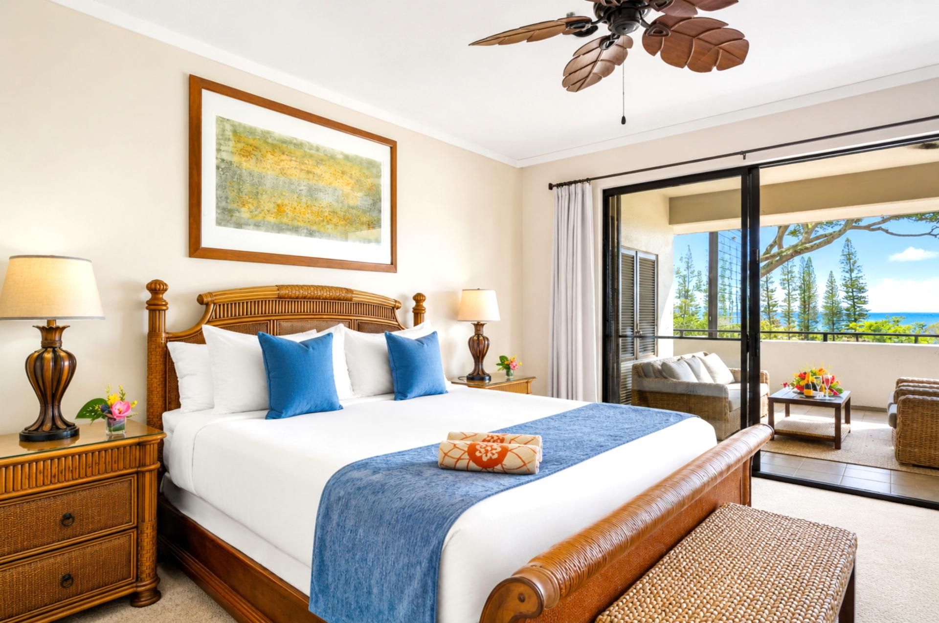 The king bedroom offers a comfortable retreat with ceiling fan, warm furnishings, and an ensuite bath just steps away.