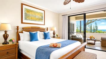 The king bedroom offers a comfortable retreat with ceiling fan, warm furnishings, and an ensuite bath just steps away.