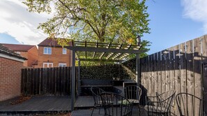 A patio with a pergola, outdoor seating, and a barbecue area. - Pass the Keys | Modern | Office & Driveway | Near Crook & Durham (Crook)