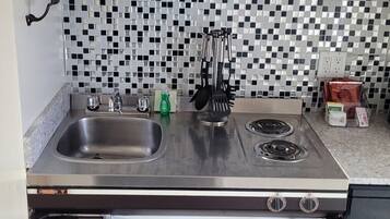 Fridge, microwave, stovetop, coffee/tea maker