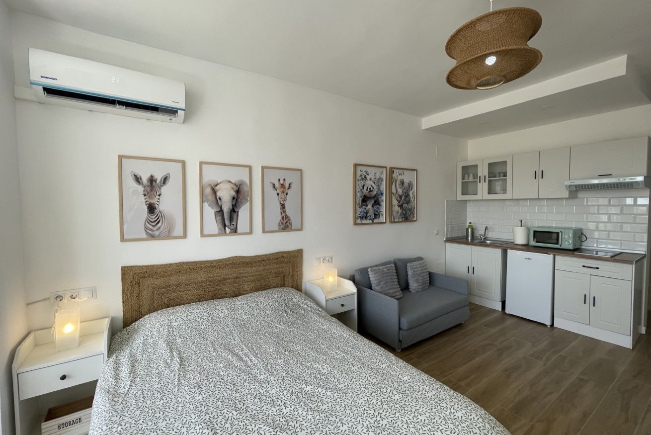 1 dormitorio, tabla de planchar con plancha, cuna de viaje y wifi gratis