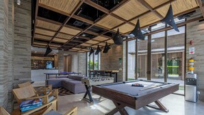 A modern indoor space with a pool table, foosball table, and seating area. - Bright villa w/ pool & outdoor grill (Cartagena de Indias)