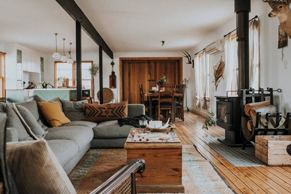 The cosy yet spacious living area offers a large, wood burning fireplace to snuggle up around in the cooler months.