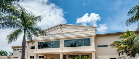 A two-story building with a sign reading "Beachfront Villas."