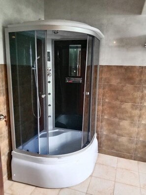Shower, slippers, towels, soap