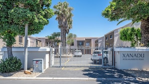 A gated entrance to a residential area with a sign reading "XANADU 66 BLAUWBERG ROAD". - Xanadu (Cape Town)