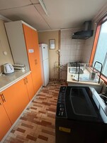 Family Cabin, Patio, Garden View | Private kitchen