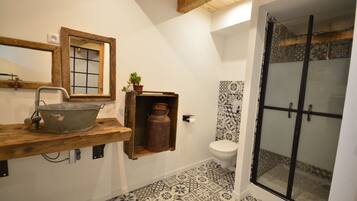 Shower, hair dryer, towels, toilet paper
