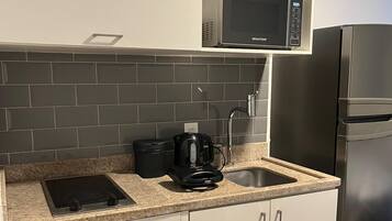 Apartment | Private kitchen | Fridge, microwave, stovetop, cookware/dishes/utensils