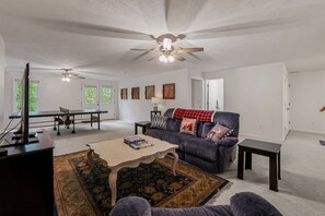 Smart TV, fireplace, table tennis, books