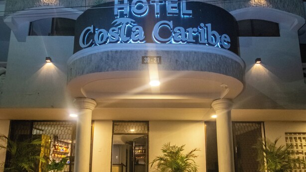 A hotel entrance with a sign reading "HOTEL Costa Caribe" and a number "3921" above the door. - COSTA CARIBE BAQ HOTEL (Barranquilla)