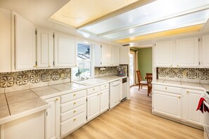 Fridge, microwave, stovetop, dishwasher - Waterfront Oasis with Pool & On-Site EV Charging. (Osteen)