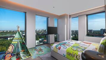 A modern bedroom with large windows, a bed with cartoon-themed bedding, a play mat, and a teepee.
