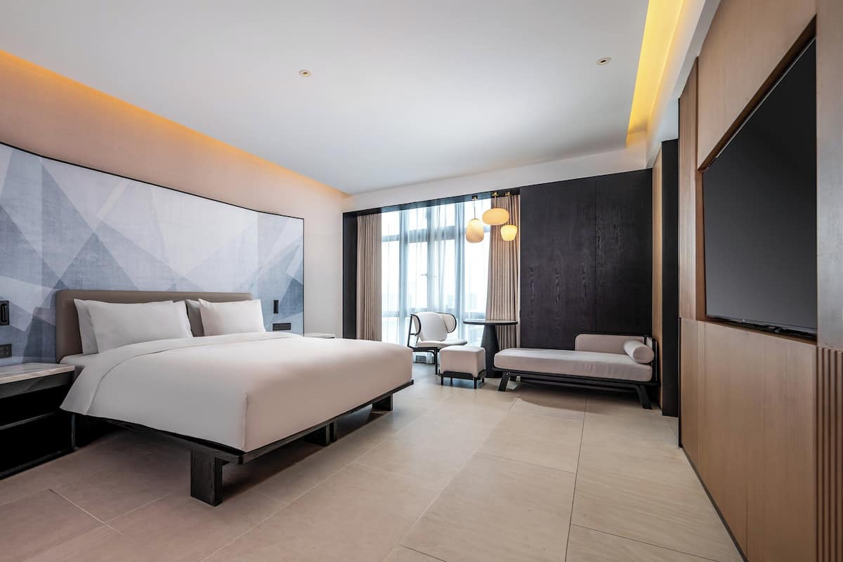 1 King Suite With Bath | Premium bedding, down duvets, laptop workspace, blackout curtains